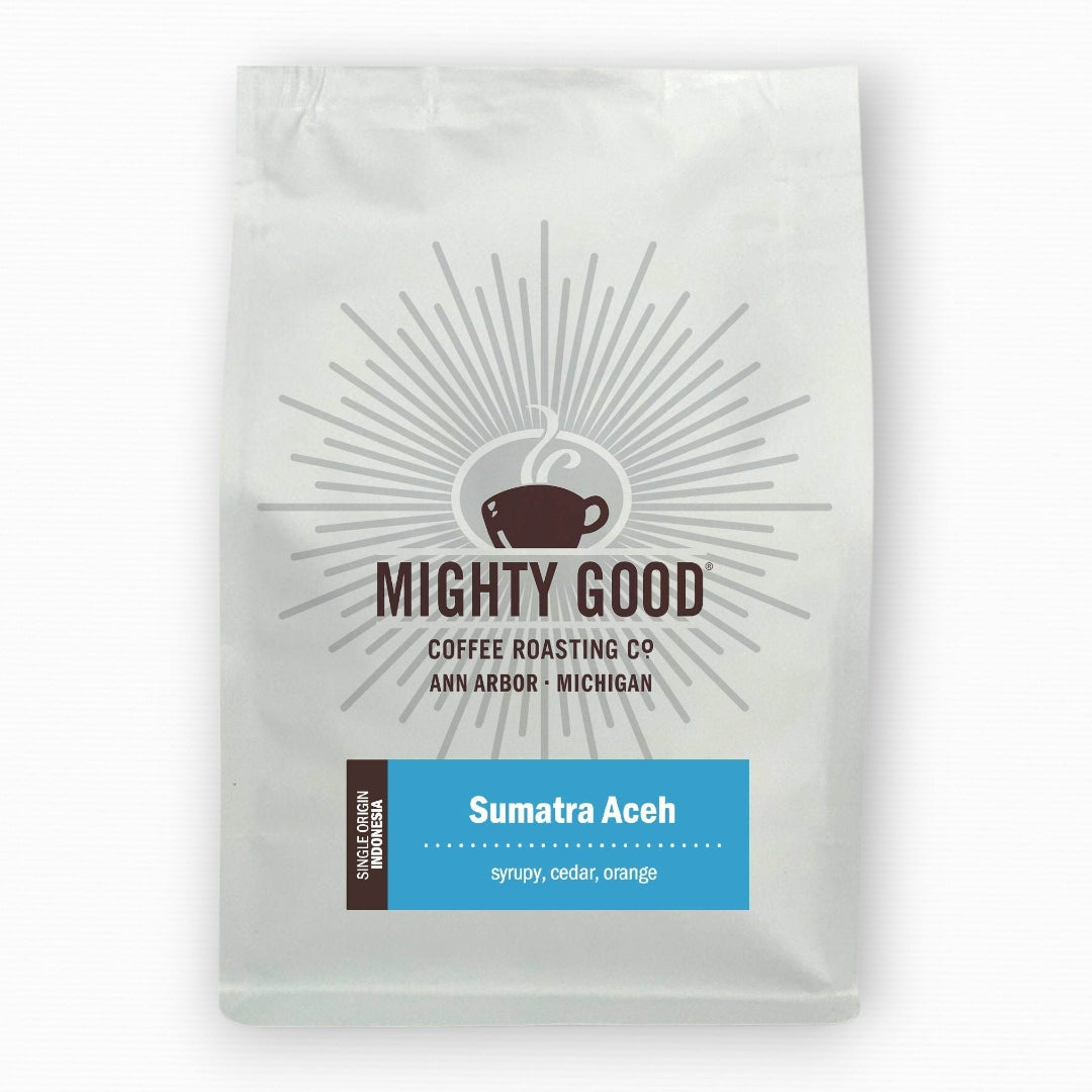 Mighty Good Coffee Sumatra Aceh 12oz bag – single origin Indonesian coffee with tasting notes of syrupy body, cedar, and orange. Specialty coffee roasted in Ann Arbor, Michigan by Mighty Good Coffee Roasting Co.
