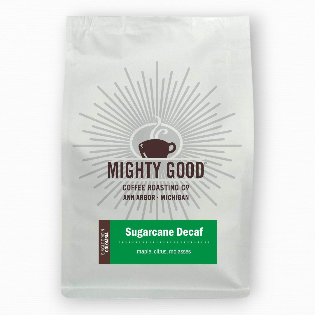 Mighty Good Coffee Sugarcane Decaf 12oz bag – single origin Colombian coffee, decaffeinated using sugarcane process, with tasting notes of maple, citrus, and molasses. Premium specialty coffee roasted in Ann Arbor, Michigan by Mighty Good Coffee Roasting Co.